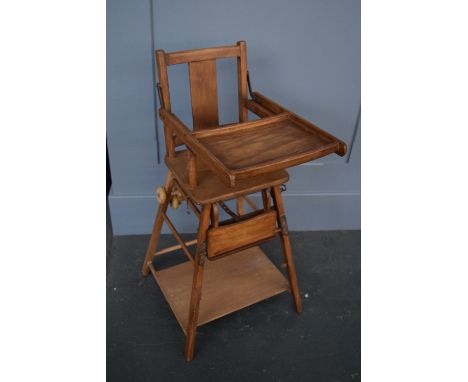 A vintage wooden metamorphic high chair/walker 94cmH