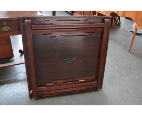 A Mudies Squeezer Card Table, London with folding legs and gree baise top 79 x 79cm together with another similar folding car