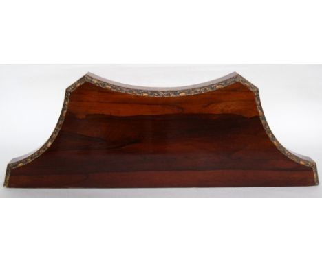 A carved mahogany hanging shelf 