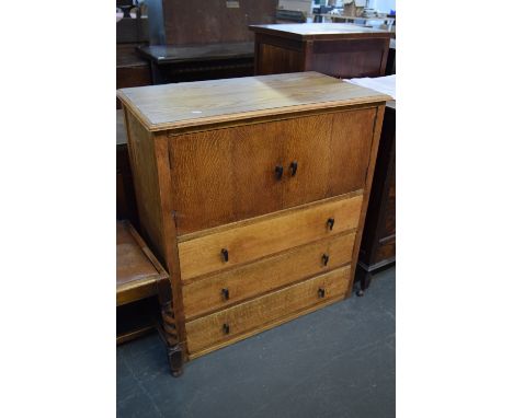 A vintage oak side unit, cupboard with double doors over two long drawers 83 x 45 x 90cm
