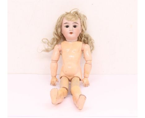 Theodore Racknagel: A Theodore Racknagel bisque head doll, composition body, open and close eyes, open mouth with four teeth.