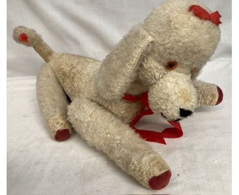 Plush: An unmarked plush toy Poodle in white, circa 1960, jointed limbs, good condition. 40cm long. Please assess photographs