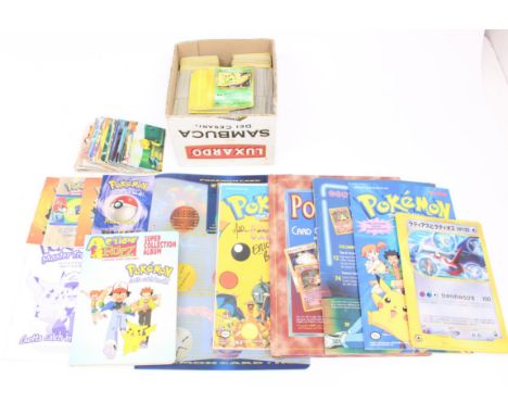 Pokemon: A collection of assorted loose Pokemon cards, ranging from various Wizards of the Coast sets, including Base, Fossil