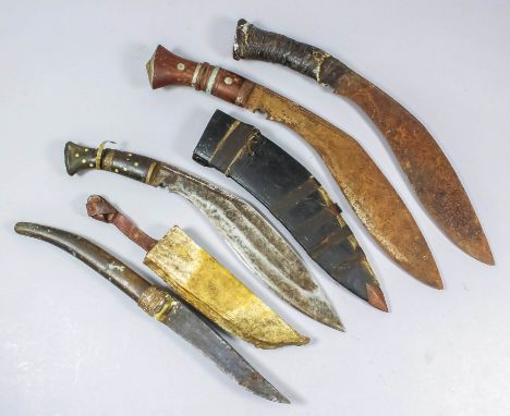 Four 20th Century daggers comprising, three (non-military) kukri, and one other in scabbard