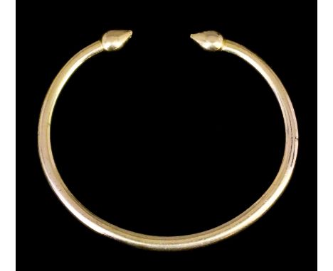 A modern gold coloured metal torque pattern bangle (gross weight 57.7 grammes) Note: Metal unmarked but tests as 22ct gold