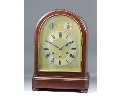 A late 19th/early 20th Century German mahogany cased mantel clock, No. 2473670, the arched brass dial with silvered chapter r