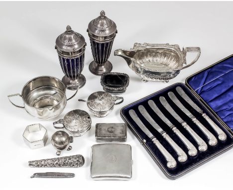A pair of Edward VII silver urn pattern sugar castors, the domed covers with flame pattern finials and with wirework sides, o