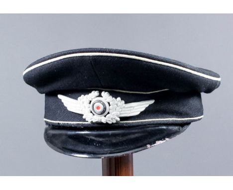 A Second World War German Diplomatic Corps (NSDAR) Officer's visor cap, finished in black with white piping, Diplomatic Corps