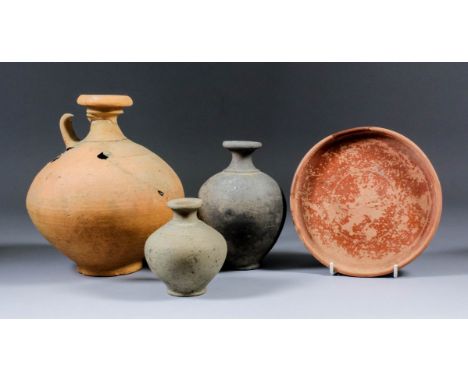 Four Roman pottery vessels, including - Samian ware dish with potters stamp to centre and early scratched inscription of thre