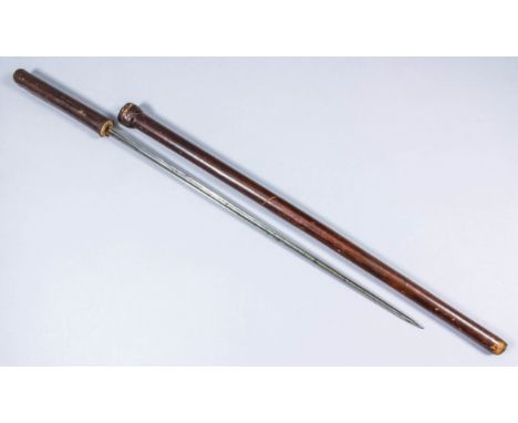 A 20th Century Indian or Sudanese leather covered swagger stick concealing a triangular steel blade, the blade 14.75ins, 22.5