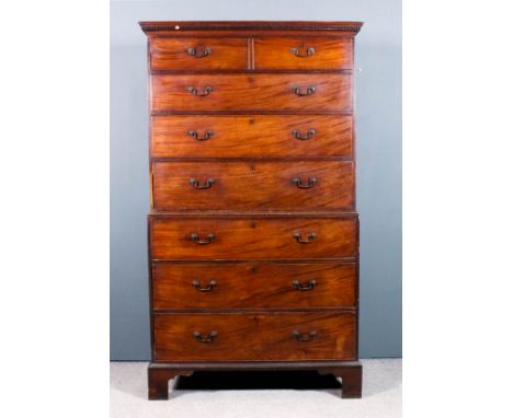 A George III mahogany tallboy, the upper part with moulded and dentil cornice, two short and three long drawers, the base fit
