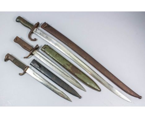 A 20th Century German "sawback" bayonet, 10ins unmarked plain steeled sawback blade, composite grips, black painted steel sca