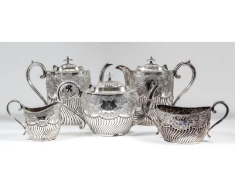 A late Victorian silver oval five piece tea and coffee service, the part reeded bodies chased and embossed with cartouche, sc