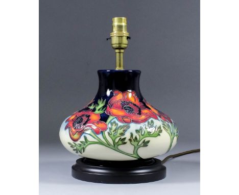 A modern Moorcroft pottery table lamp, tube-lined and decorated in colours with a poppy design, 10.5ins high, and shade for s