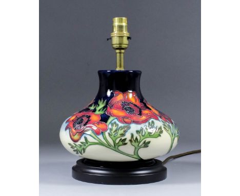 A modern Moorcroft pottery table lamp, tube-lined and decorated in colours with a poppy design, 10.5ins high, and shade for s