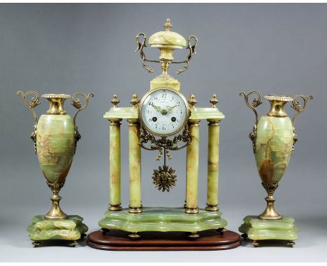 A late 19th/early 20th Century French gilt brass and green veined onyx three piece clock garniture by Vincent & Cie, No. 5024