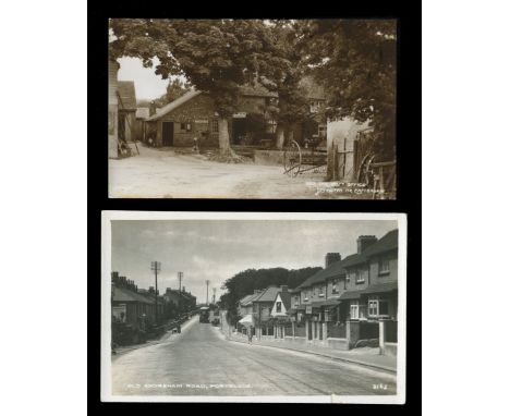 Two albums containing approximately 361 postcards of Sussex, the majority coastal locations, including photographic postcards