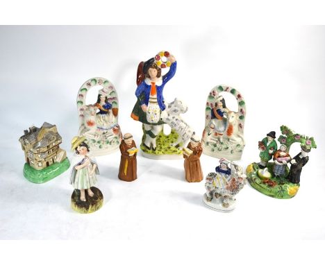 A collection of 19th century Staffordshire  comprising:  A 'Tithe Pig Group', after the original by Obadiah Sherratt, 15 cm h