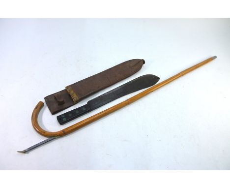 A World War II Military Issue jungle machete by Martindale, 1945, in leather scabbard, to/w a walking stick/horse measure (2)