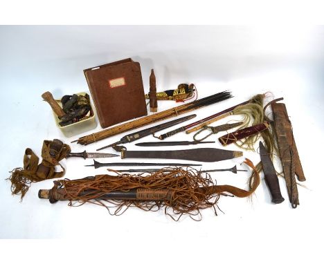 An interesting collection of African and Asian edged weapons, including Kris and other blades, all a/f to/w a bundle of arrow