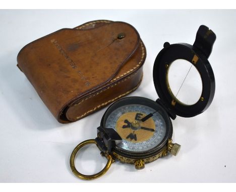 A brass and lacquered pocket bearing-compass, with mother of pearl dial, in leather case, named for De Selincourt