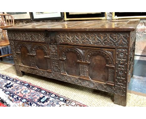 AMENDMENT - NO PROVENANCE AS PRINTED IN THE CATALOGUE  A large part 18th century oak coffer, the four panel joint framed top 