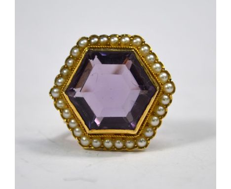 A Victorian hexagonal yellow gold brooch, the central hexagonal amethyst in millgrain setting surrounded by row of small pear