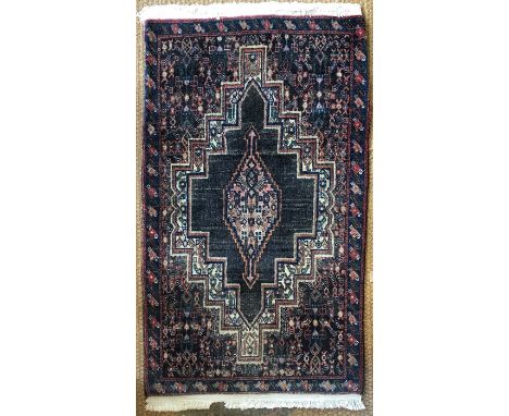 A pair of Persian Senneh small rugs circa 1950's, the centre medallion on ivory/blue ground (2)