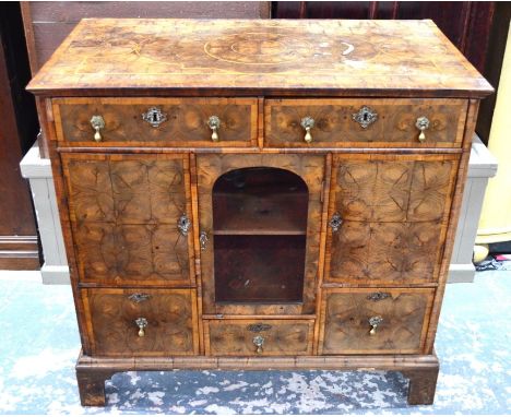 A William &amp; Mary and later altered oyster veneered chest formed of concentric rings to the top, sides and drawer fronts, 