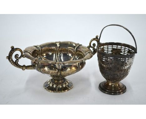 A George III pierced silver basket with swing handle, engraved with Adam-style swags and above embossed acanthus, on stemmed 