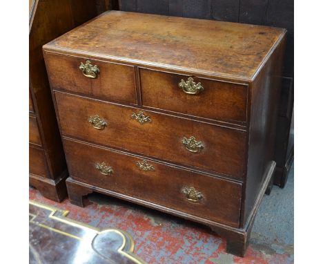 A Georgian oak chest of two short over two long graduated drawers, raised on shaped bracket feet, 84 cm w x 48 cm x 80 cm h