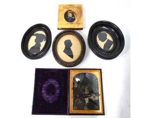 Three various cut-out silhouettes, a painted-over photograph portrait miniature of an old lady and a leather cased portrait p