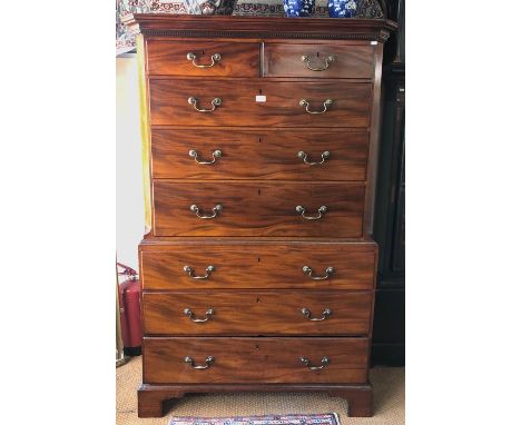 A George III mahogany chest on chest, the dentil moulded cornice over an arrangement of two short and six long graduated draw