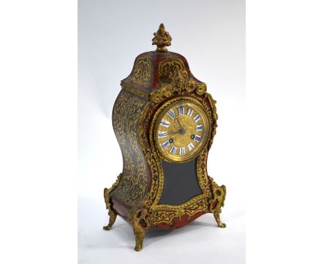 A 19th century French Rococo Revival Boulle mantle clock with gilt metal mounts, drum movement by Rollins of Paris striking o