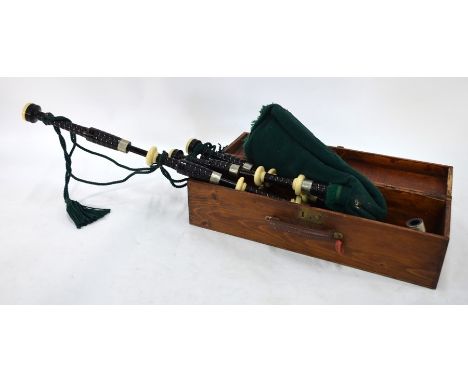 A vintage set of bagpipes, the ebonised pipe with simulated ivory mounts, associated rosewood chanter stamped for J Robertson