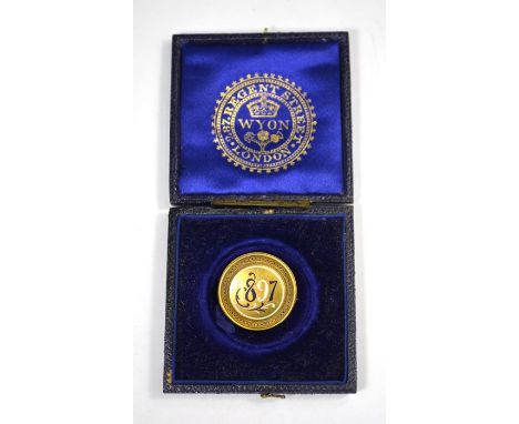 A Victorian circular yellow gold brooch with blue and white enamel date of 1897, the reverse inscribed 'From Victoria R I Nov