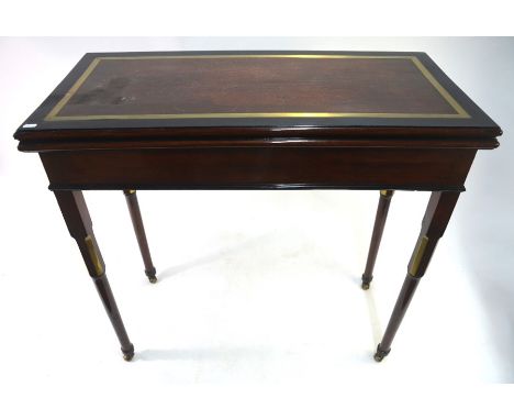 A George III brass and ebony banded mahogany card table, the fold over top revealing a baize lined surface incorporating coun