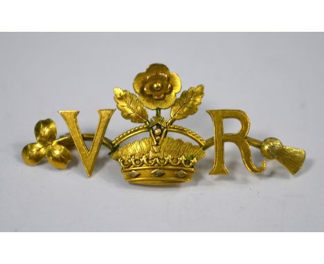 A Victorian yellow gold brooch with crown and rose motif flanked by the initials V and R, brooch fitting missing, 4 cm longPr