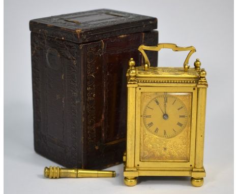 A fine quality Victorian gilt metal 'mignon' miniature carriage clock with floral-engraved case, by Howell James & Co of Lond