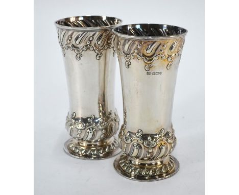 A pair of late Victorian silver vases embossed with scrolls and gadrooning, Harrison Bros.&amp; Howson, Sheffield 1898; 13.4 