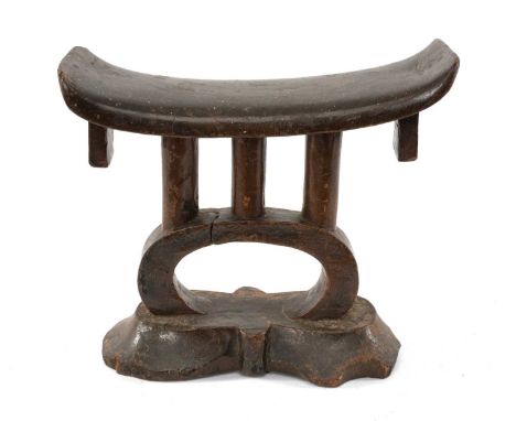 TSONGA HEADREST, rectangular bowed platform with square pendant lugs, above triple column and arch support and lobed base, 14