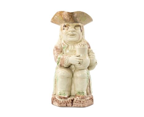 LATE 18TH C. WOOD FAMILY TYPE CREAMWARE TOBY JUG, seated figure with oversized baluster jug of frothing ale (pierced through)