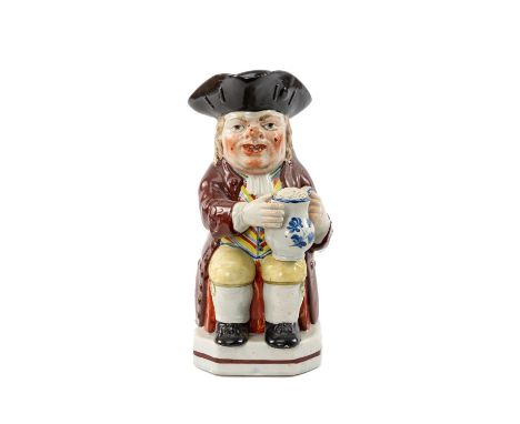 EARLY 19TH C. PEARLWARE TOBY JUG, by John Walton, brightly painted in coloured enamels, seated figure wearing striped waistco