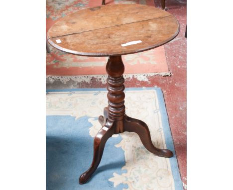 A 19th century oak and elm tilt-top tripod table