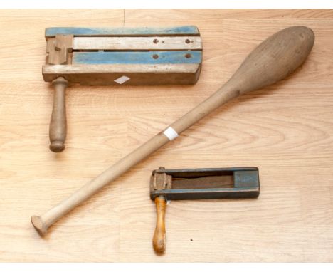A pair of wooden football rattles and a juggling baton