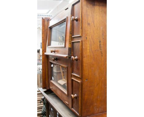 A George III style oak double door bookcase top and a wall hanging set of shelves, standard lamp and a table lamp (4) 