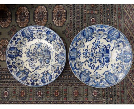 A pair of Delftware blue and white chargers, hand painted, 35 cm in diameter (2)