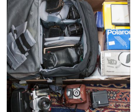 A boxed vintage Praktika  camera with lenses accessories including lowepro bag