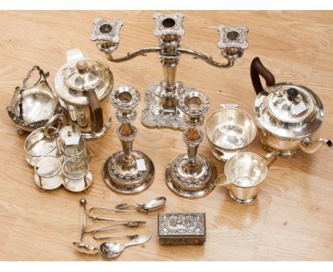 A four piece Viners (Sheffield) tea service, a three prong candelabra and a pair of candlesticks, an RAF part cruet set and s