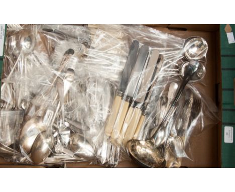 A large collection of assorted silver plated flatware, comprising teaspoons, dinner knives and forks, dessert knives and fork